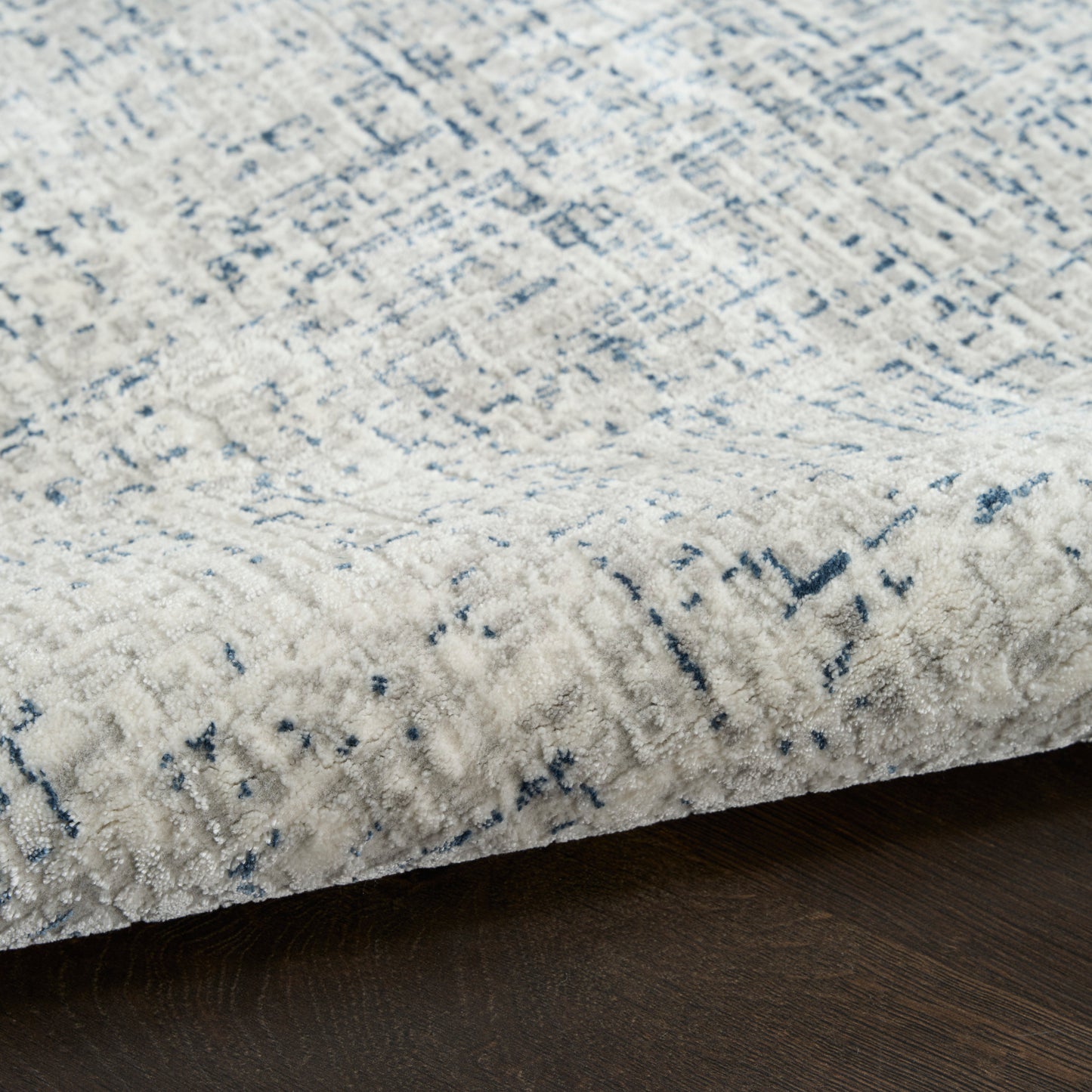 DKNY Grand Street 9' x 12' Ivory Blue Modern Indoor Rug