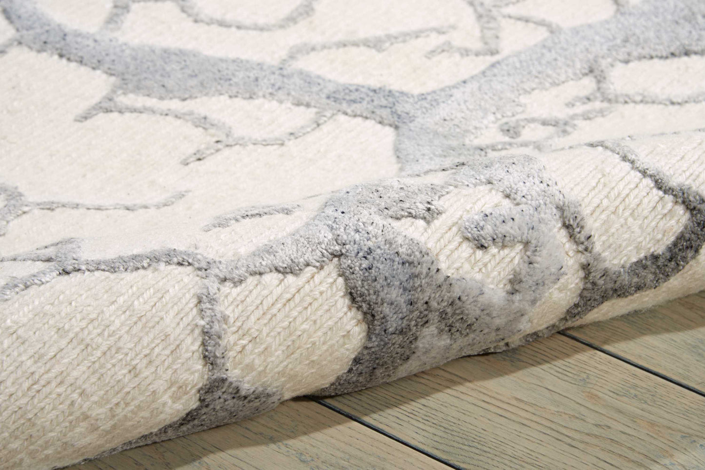 Nourison Divine 9'9" x 13'9" Ivory Modern Indoor Rug